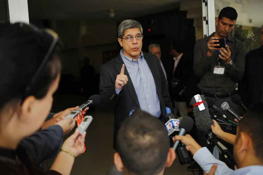 AP: FILE - In this Dec. 12, 2018, file photo, Cuba's Director-General of U.S. Affairs Carlos Fernandez de Cossio makes a statement to reporters, in Havana, Cuba. De Cossio says his nation has no troops in Venezuela but it maintains the right to military and intelligence cooperation with its ally. (AP Photo/Desmond Boylan, File)