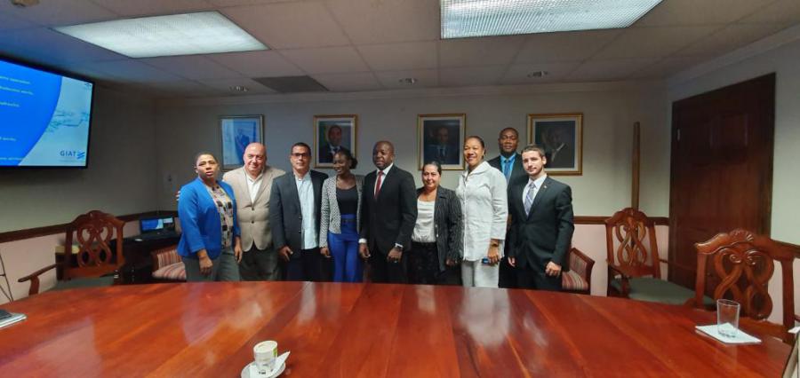 Cuban commercial delegation exchanges with Jamaican Minister of State.