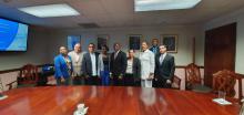 Cuban commercial delegation exchanges with Jamaican Minister of State.