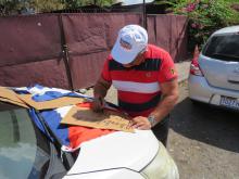 Cuban residents in Jamaica join the caravan condemning the blockade held against Cuba